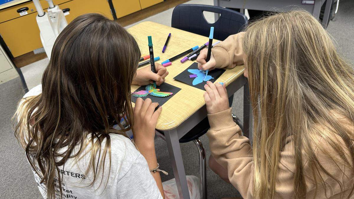Fifth-graders enrolled in Baywood Elementary School’s dual-immersion language program work on their end-of-year art project.