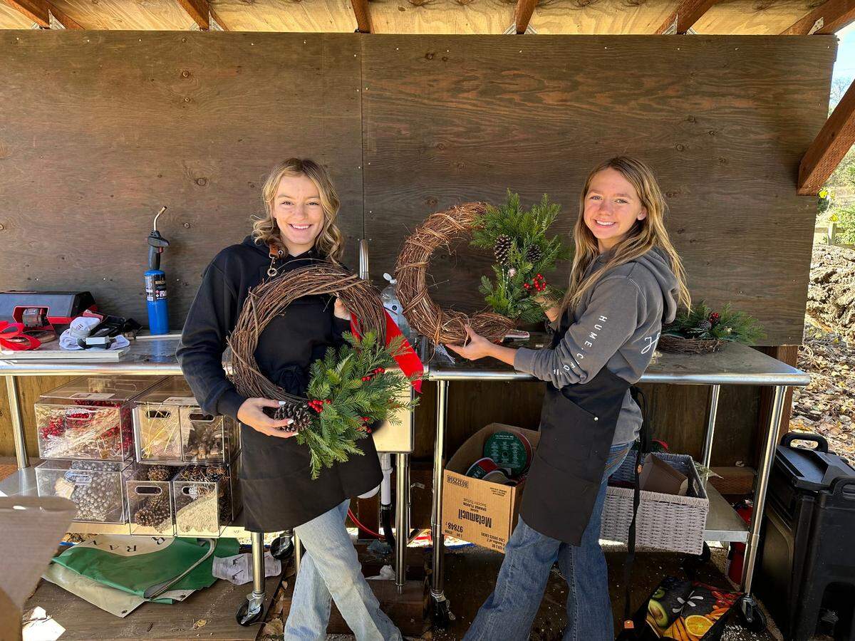 Amy George’s two daughters make and sell wreaths at the Salinas River Ranch Christmas tree farm.