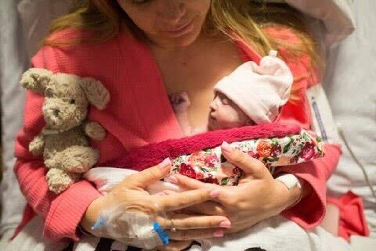 Ashley Agnitch of Arroyo Grande holds her daughter, Greta Agnitch, in April 2017. Greta died shortly after her birth due to a genetic condition.