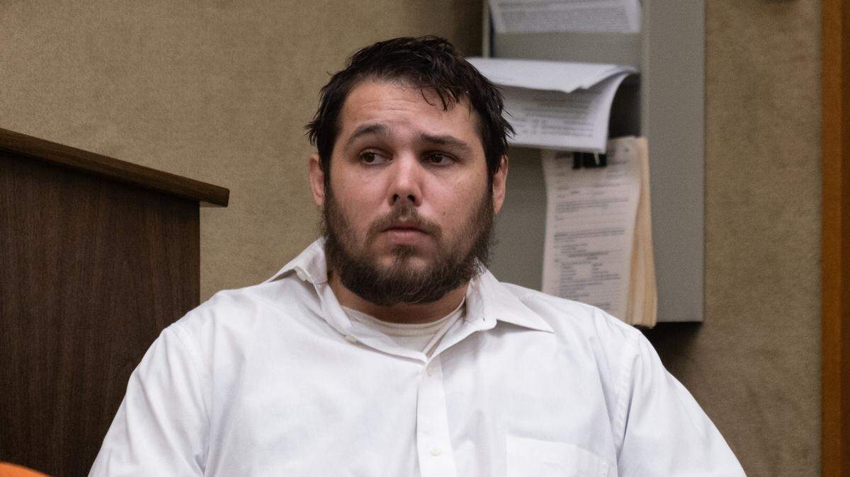 Justin Tray Buchanan sits in a court hearing at San Luis Obispo Superior Court on Aug. 3, 2023. He is charged with the murder of his stepmother and attempted murder and assault of his father.