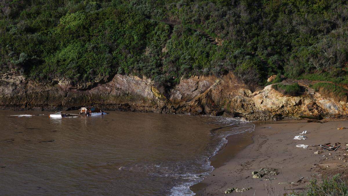 A boat ran ashore and broke up on the rocks of Pirate’s Cove after its operators tried to anchor off the coast through the storm on Tuesday against the advice of the Harbor District. Debris washed to the shore of the cove on March 16, 2023.