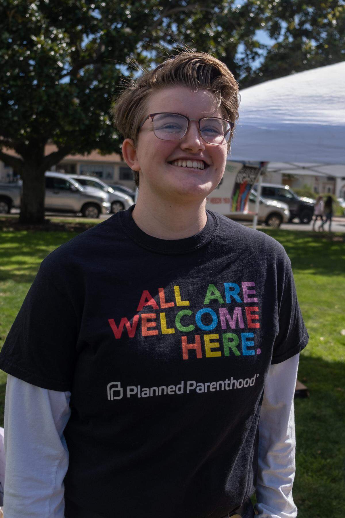 Sandra Mathias poses in her yellow and blue outfit at the Engage for Equity Rally in San Luis Obispo on March 5, 2022.