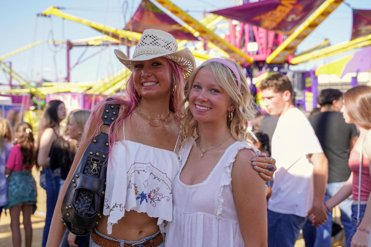 Fair attendees Kirra Doherty and Ava Beckett pose for a picture at the California Mid-State Fair on Wednesday, July 16, 2025. The Mid-State Fair will run from July 16-27.