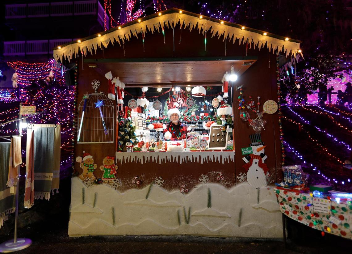 Cambria business owner Dutch Felgenhauer mans the booth for his All Things Cambria business at the Cambria Christmas Market on Wednesday, Dec. 14, 2022. He says the Christmas Market is phasing out the Christmas-themed booths in exchange for pop-up wooden booths used at German holiday markets. The new booths are easier to assemble.