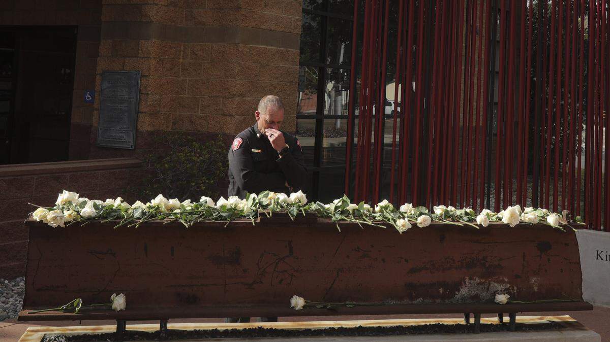 San Luis Obispo Fire Chief Todd Tuggle took a moment in front of the World Trade Center memorial on Sept 11, 2025. About 60 people gathered at San Luis Obispo Fire Station 1 to honor the sacrifices made responding to the terrorist attacks that took place on Sept. 11, 2001.