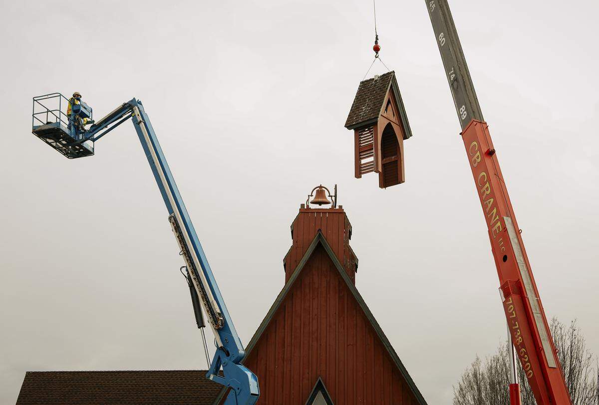 The top half of the steeple dangles from a crane as part of the process of removing the old steeple at St. Stephen’s Church in San Luis Obispo after nearly 50 years. A fire in the 1970s destroyed the original steeple, and the current one needed replacing. Photo by Joe Johnston 02-19-18