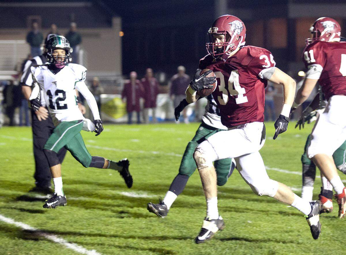 Paso Robles High School receiver Bailey Gaither scores one of his five touchdowns in the Bearcats’ playoff win in 2014.