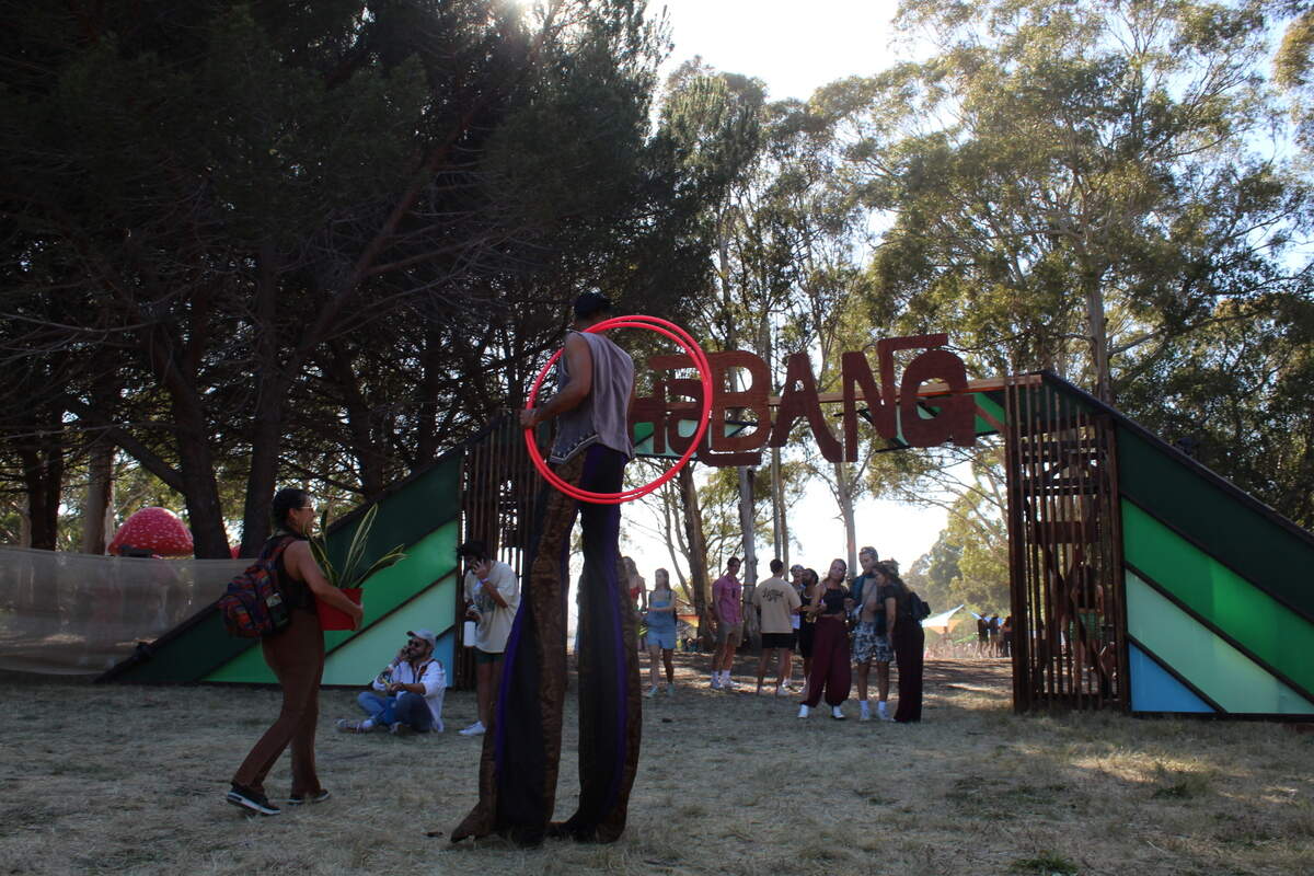 An entertainer on stilts welcomes people entering Shabang on Friday, May 13, 2022.