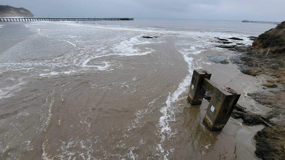 Muddy San Luis Obispo Creek empties into the ocean at Avila Beach on Tuesday, Dec. 14, 2021.