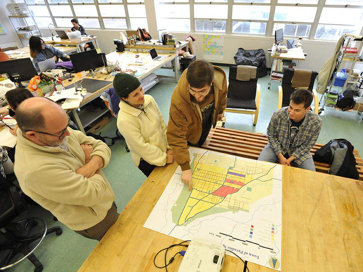 From left to right, Cal Poly architecture faculty member Kent Macdonald, and students Sophia Smith, Ryan Huddlestun and Foster Westover describe their proposed concept plan for the town of Paradise.