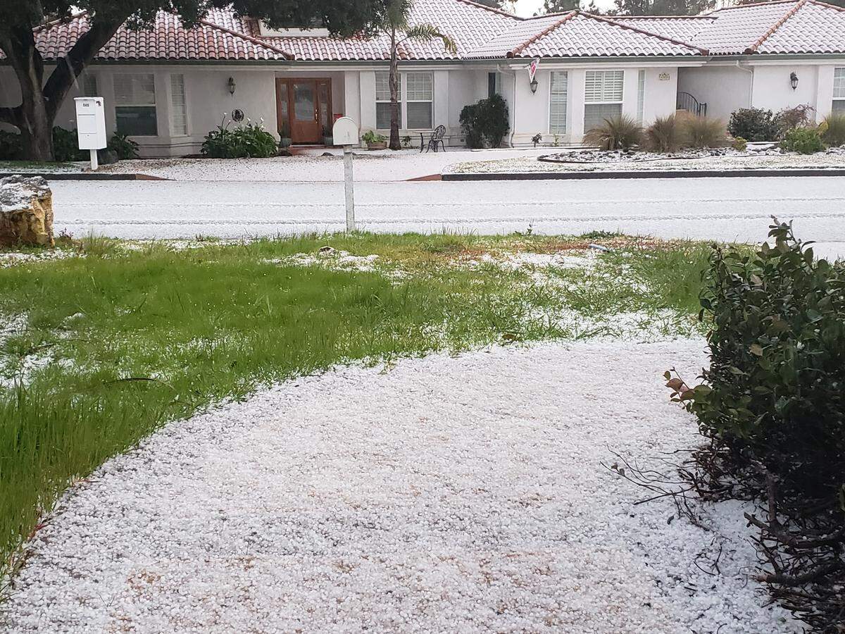 Hail completely covers a residential area of Nipomo, California.