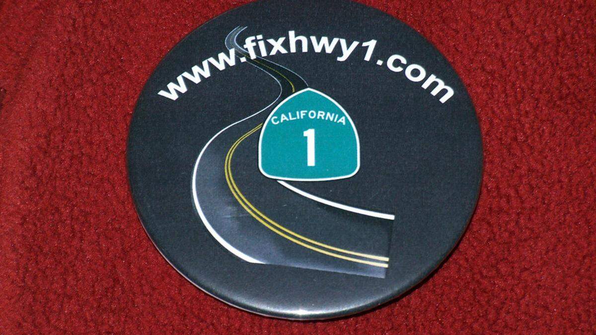 A button worn by many of the more than 30 bicyclists at a San Luis Obispo Council of Governments meeting Wednesday bears the address of a website supporting resurfacing of Highway 1 after what’s said to be a botched repaving job last fall.