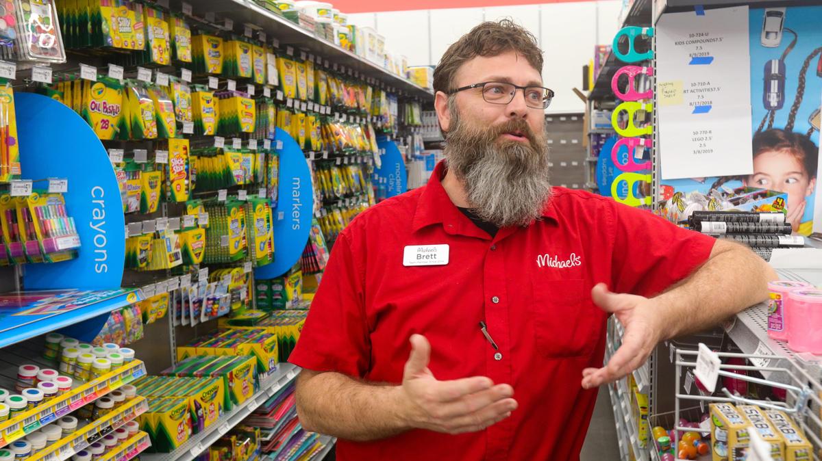 Manager Brett Oliver talks about the opening of a new Michaels arts and crafts store Aug. 16 at a new location in the former Sears building in Madonna Plaza.