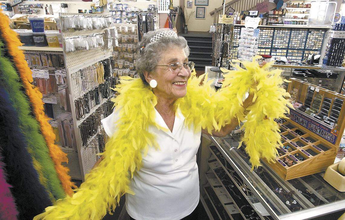 Beth Law, 85, has some fun with a boa and a tiara in her store on Aug. 27, 2004. As owner of Law's Hobby shop in San Luis Obispo, Beth says "every day is a casual dress Friday."
