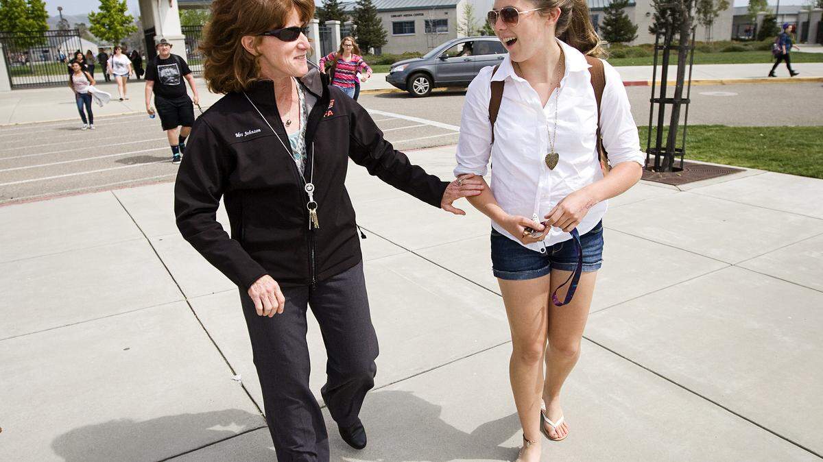 Nipomo High School Principal Michelle Johnson speaks with senior Annalise Ketz as as school lets out Monday, April 21.