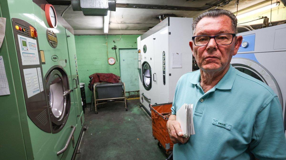 Rod Morabito, genereal manager of Paul’s Dry Cleaners & Laundry in San Luis Obispo, stands in front of a newer dry cleaning machine in February 2023. Morabito said he feels it’s his duty to the health of the public and the environment to clean up pollution from a potentially cancer-causing chemical called PCE, which measured more than 850 times the amount considered safe for humans. “It’s painful, but you gotta do it,” Morabito said.