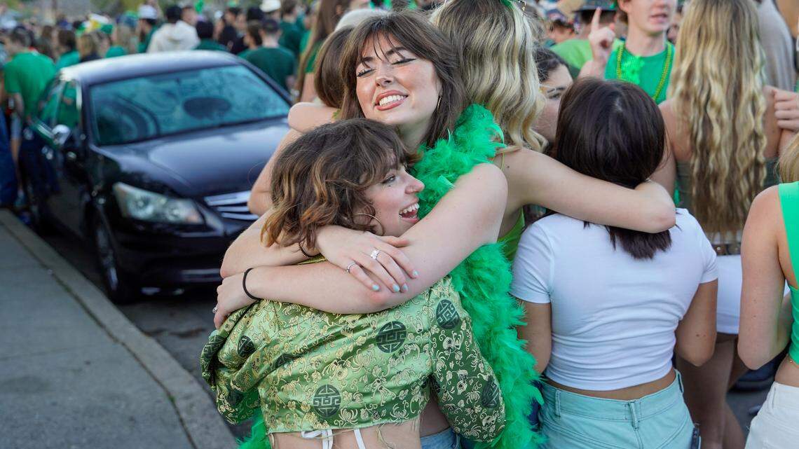 Cal Poly students Hazel and Gizelle hug at the St. Fratty’s Day party on Hathway Avenue near the university on March 16, 2024. A San Luis Obispo Police Department officer at the scene of the party estimated between 6,000 and 7,000 people in attendance.
