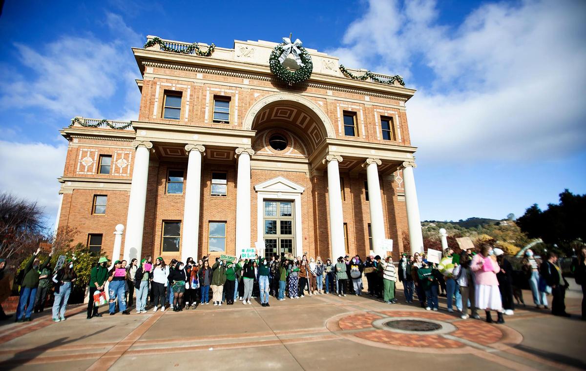 About 100 Atascadero High School students, alumni and parents walked to City Hall on Friday to protest incidents of sexual harassment, racism and homophobia revealed in anonymous stories on a new Instagram account.
