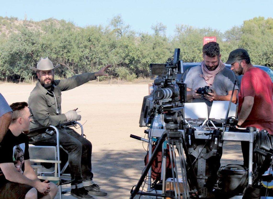 Filmmaker David McAbee sports a cowboy hat on the set of “For the Love of Jessee.” appear in a scene from “For the Love of Jessee.” The Coast Union High School graduate directed and wrote the film.