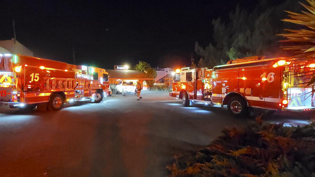A fire started in a smoker and traveled to the wall at Kuma Restaurant located at 2011 10th Street in Los Osos. Firetrucks parked in the Kuma parking lot.