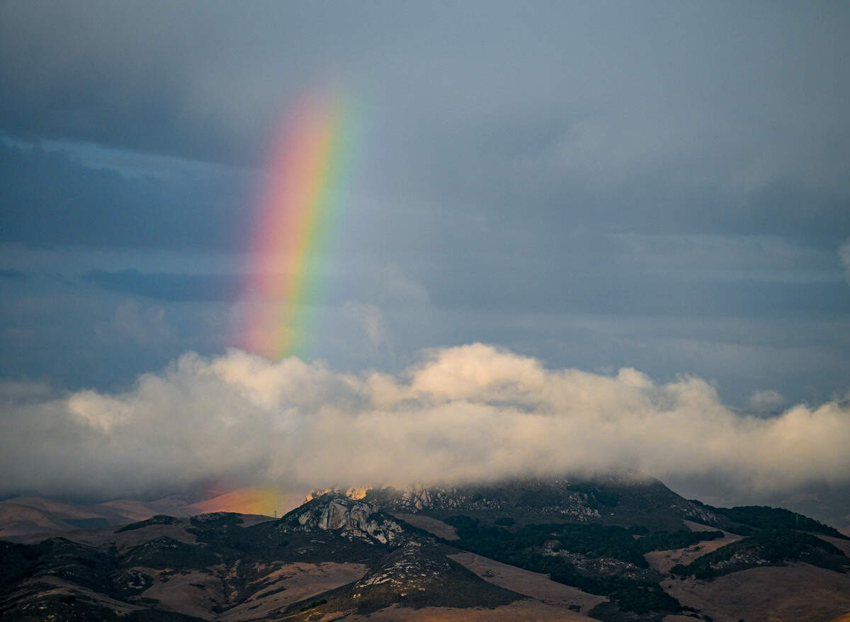 A rainbow formed behind low-level stratus clouds near Hollister Peak in Los Osos.