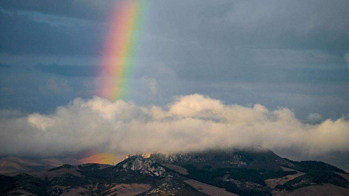 A rainbow formed behind low-level stratus clouds near Hollister Peak in Los Osos.