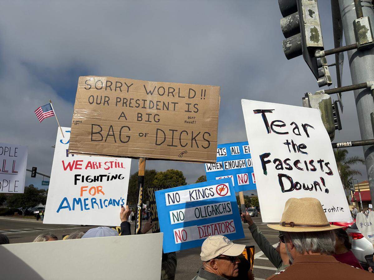 At a “Good Trouble” rally in Arroyo Grande, protesters waved signs saying “Tear the fascists down” and “No kings, no oligarchs, no dictators.” July 17, 2025
