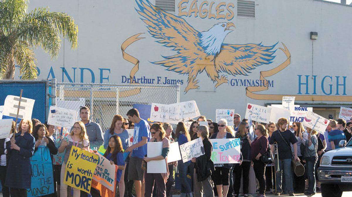 Lucia Mar teachers, parents and students gather at Arroyo Grande High School on Tuesday, Feb. 25, 2015, to march to the district boardroom to picket the school board meeting.