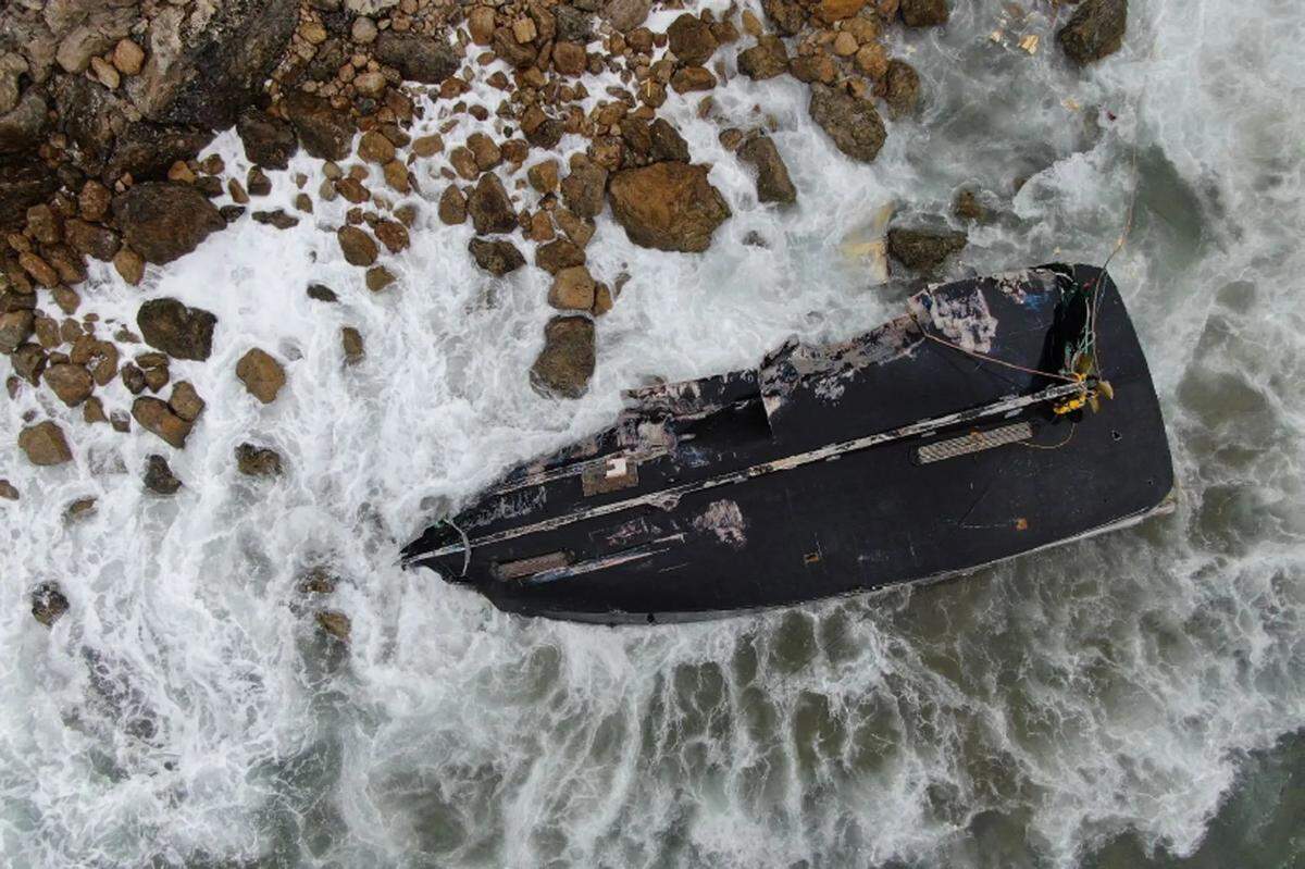 The commercial squid-fishing boat Speranza Marie lies on the rocky shoreline on Santa Cruz Island.
