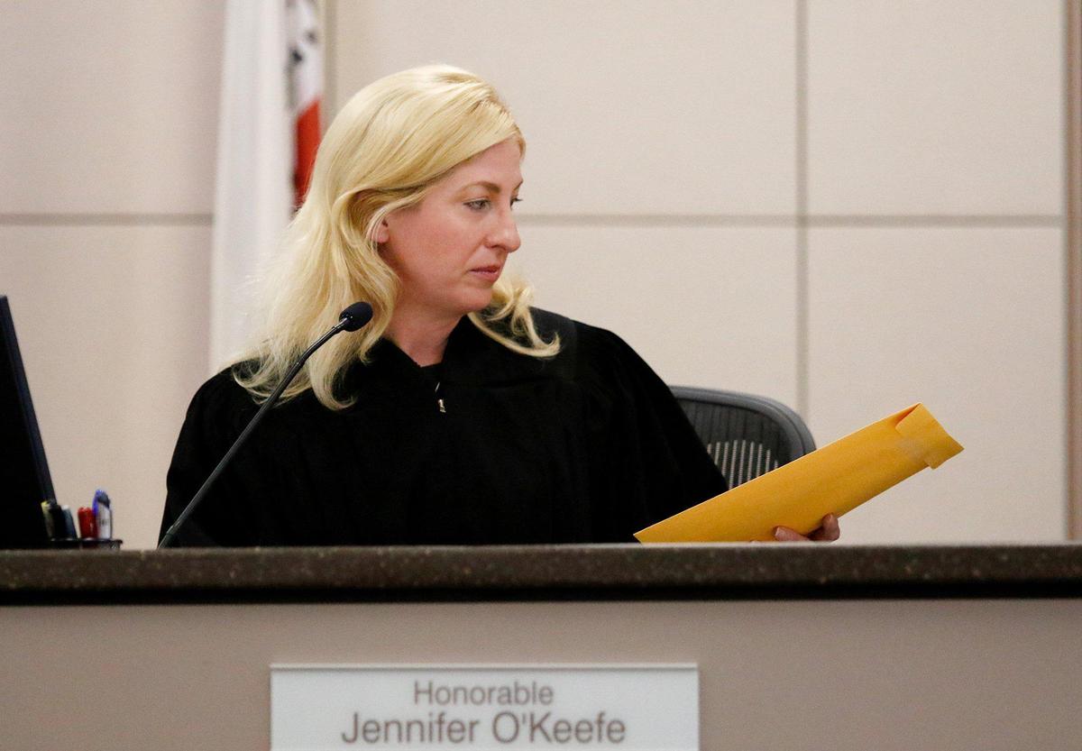 Monterey County Superior Court Judge Jennifer J. O’Keefe hands the verdict envelope to the courtroom clerk for safe keeping on Oct. 17, 2022 until the jury in the Paul Flores case reaches a verdict.