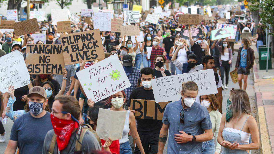 The June 4 rally was followed by a march, here traveling up Marsh Street in San Luis Obispo.