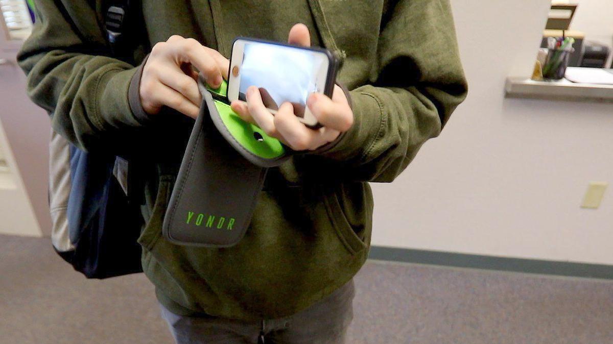 Brandon Smith puts his cell phone in a locked pouch. Students are interacting more now that Lopez High School has gone “phone-free” with a new policy that prevents students and staff from using their personal phones during the school day. The phones are locked up in special pouches and kept by the student, and then unlocked at the end of the day. 8-29-2019 David Middlecamp