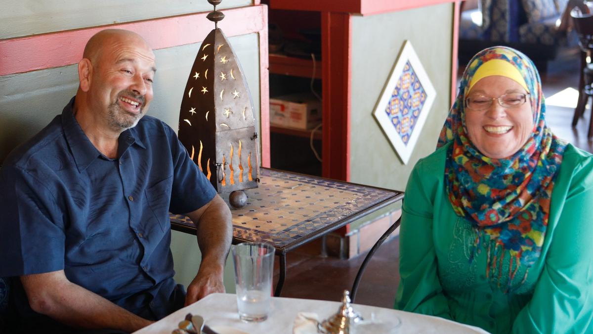 Karim and Chantale BenBrahim, the owners of Oasis Restaurant, share a laugh at their second location in Pismo Beach. They recently moved out of their other, longtime location in downtown San Luis Obispo.