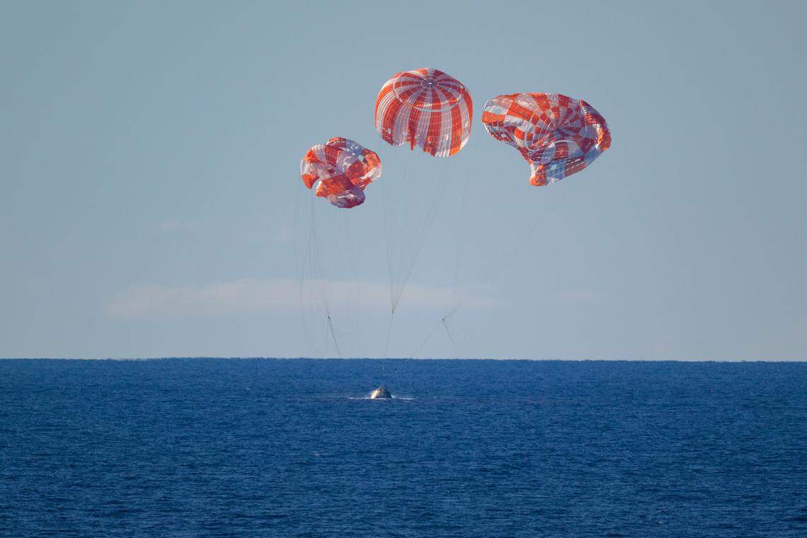 NASA’s Orion spacecraft with Artemis II lands in the Pacific Ocean off the coast of California, Friday, April 10, 2026.