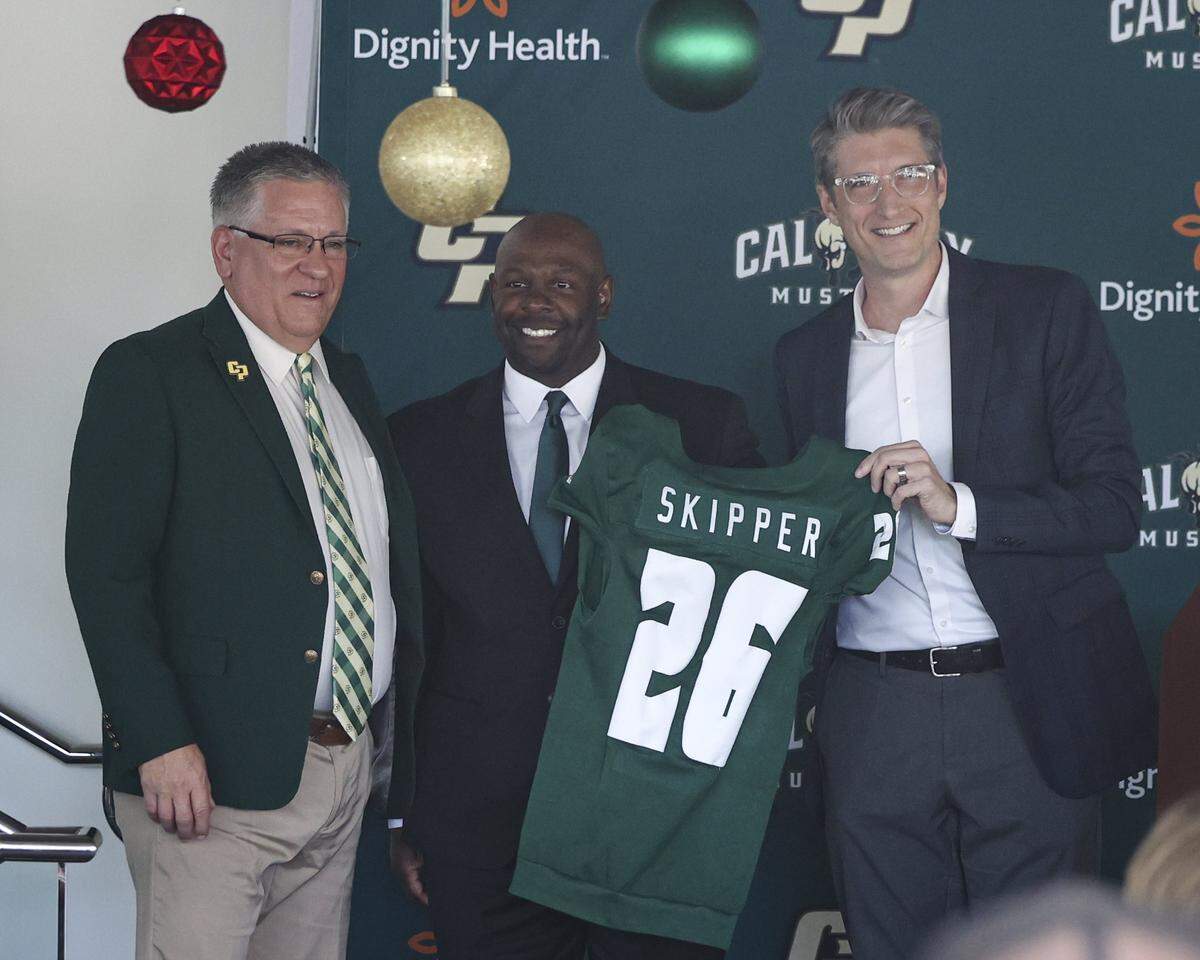 Cal Poly President Jeffrey Armstrong, new football head coach Tim Skipper and Carter Henderson, Cal Poly athletics director on Dec. 8, 2025.