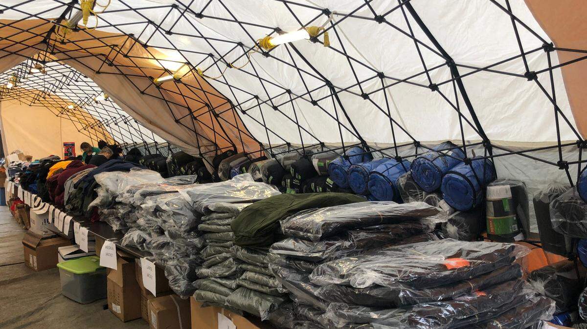 SLO’s annual Christmas Dinner for the Homeless still took place this year, but the COVID-19 pandemic led to some changes. Dinners and care packages, which included the warm clothing and sleeping bags seen here, were offered to go.