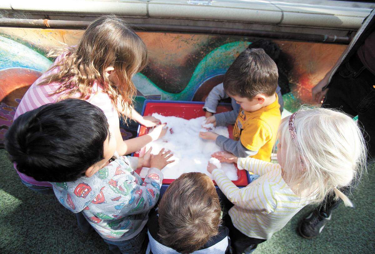 On a warm Saturday in December 2014, kids at the Children’s Museum in San Luis Obispo got the opportunity to play with artificial “snow” Saturday during a demonstration by museum staff person, Enzo Capone. The substance, called Insta-Snow, turns into a white, fluffy snow-like substance, complete with a wet, cold feeling, when water is added. From left, Emily Landine, 9 Arroyo Grande, Christopher Lopez, 5, Chico, Brady Bittle, 5, San Mateo, Franki Morrow, 3, SLO and Henry Podsakoff, 5 Davis.