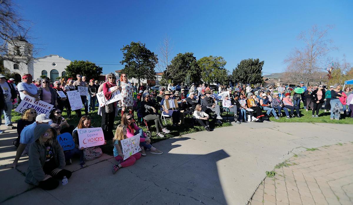 Women’s March attendees hold signs while listening to speakers at Mitchell Park. Planned Parenthood of San Luis Obispo sponsored the event this year on Saturday, Jan. 21, 2023, in San Luis Obispo.