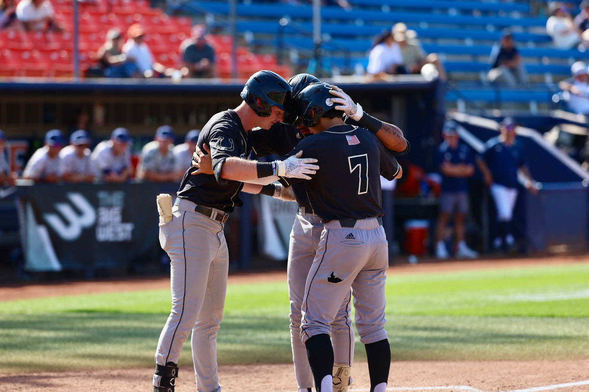 Mustangs regroup near the plate as they prepare for another inning during the Big West championship.