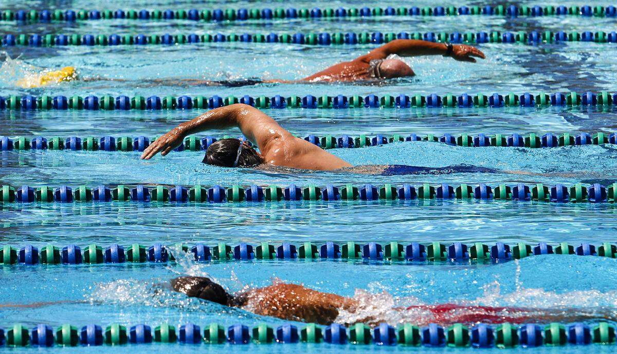 Swimmers swim laps at the SLO Swim Center in San Luis Obispo.