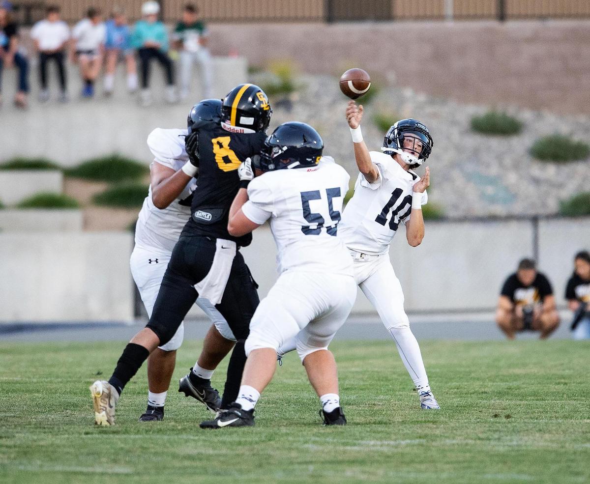 Arroyo Grande quarterback Drake Missamore (10) throws a pass under pressure in the Eagles’ 26-14 win over San Luis Obispo on Friday, Sept. 2, 2022.