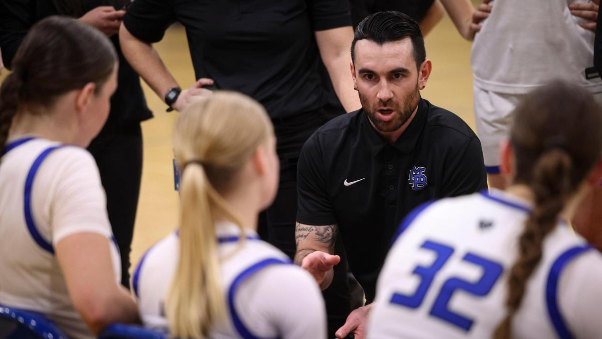 Morro Bay Head Coach Alex Engel talks to the team during timeout. Morro Bay beat Roosevelt 39-24 in the CIF Central Section Division 3 girls basketball semifinals on Wednesday, Feb. 21, 2024.