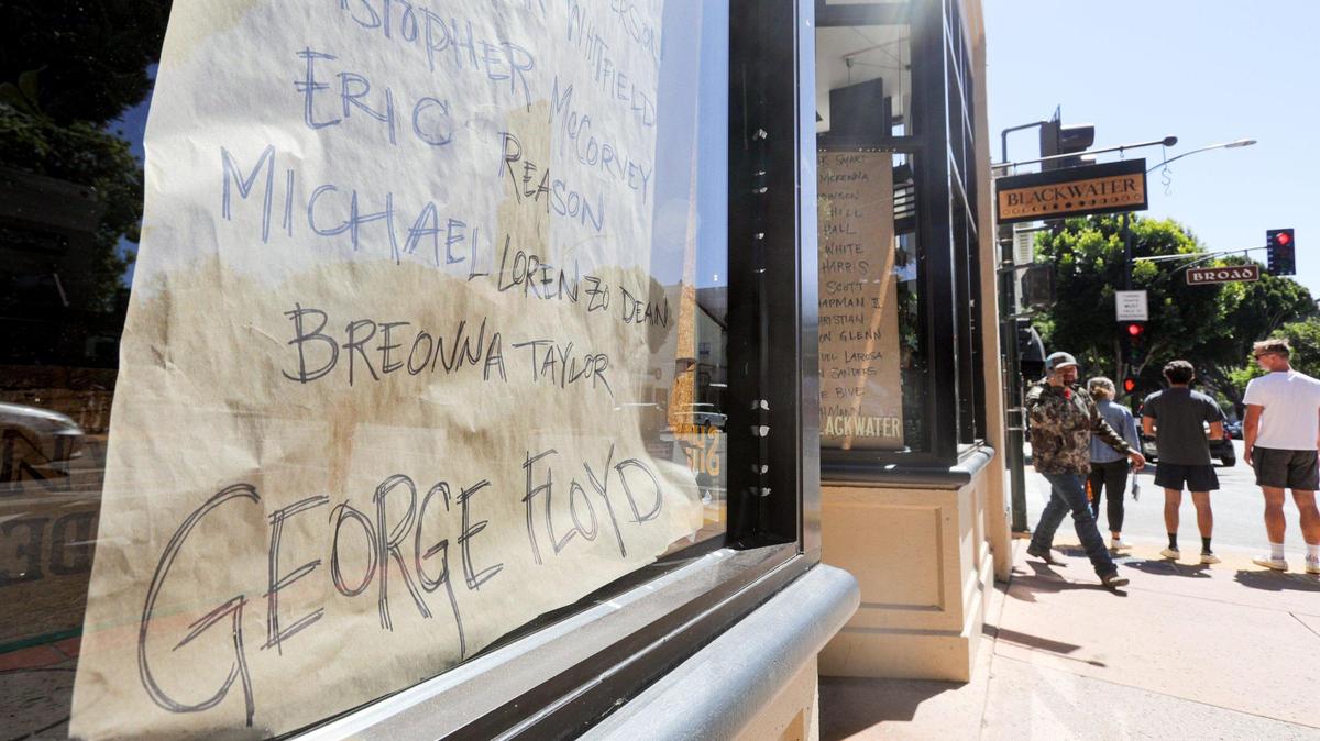 Erica Hamilton and mom Maryalice Hamilton are co-owners of boutique Blackwater on Higuera Street. Several businesses boarded up downtown after the Monday Black Lives Matter march. After one day of blank paper in the windows they decided they needed to make a statement of support, listing names of victims of violence.