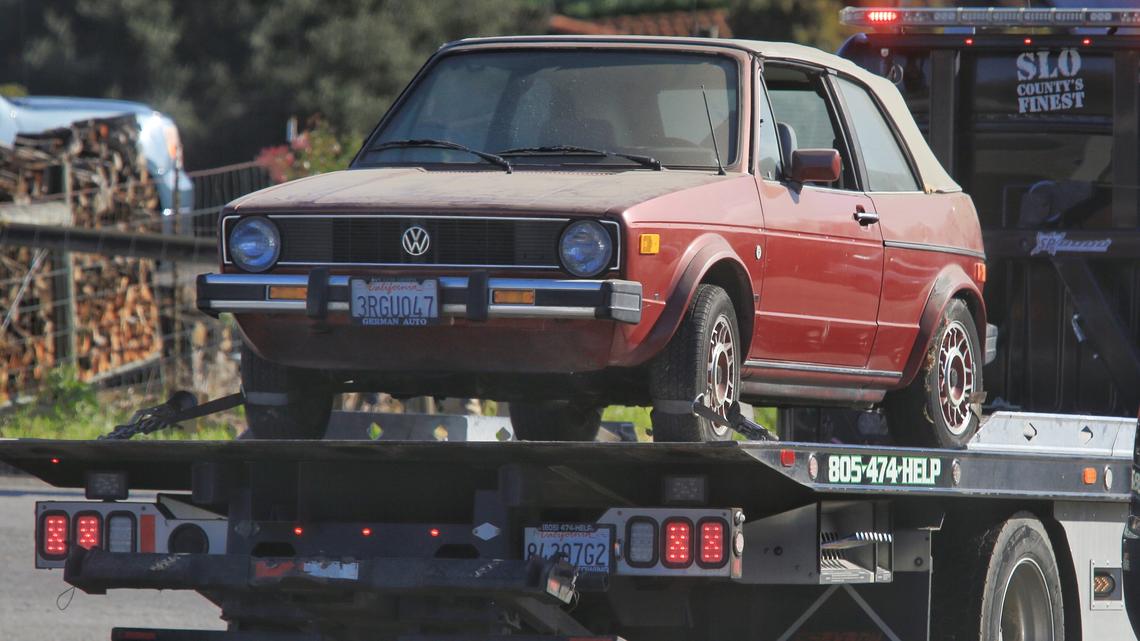 A Volkswagen Cabriolet is towed away from the Arroyo Grande home of Ruben Flores, father of Paul Flores, suspect in the 1996 disappearance of Cal Poly student Kristin Smart, on March 15, 2021.