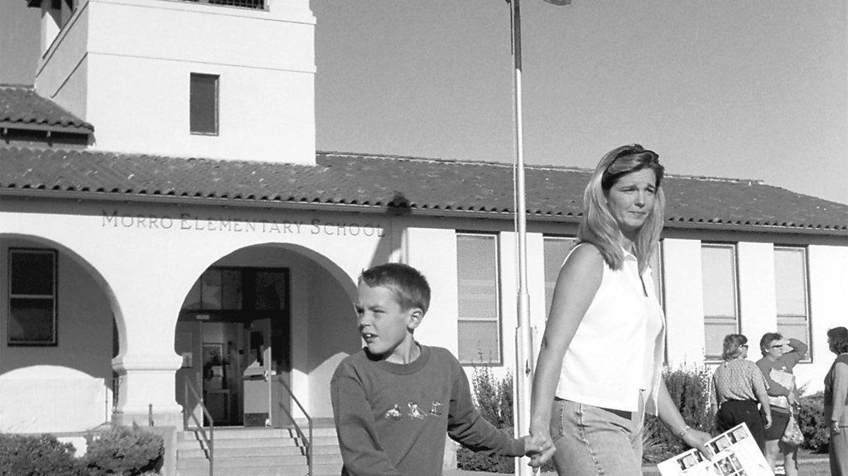 Kim Stultz picks up her son Michael, 9, a third-generation Morro Elementary School student, after class in 2001. She is a second generation student of the school in Morro Bay. The San Luis Coastal school district closed the school and combined it with Del Mar Elementary on the north side of town in at the end of the 2001-02 school year.