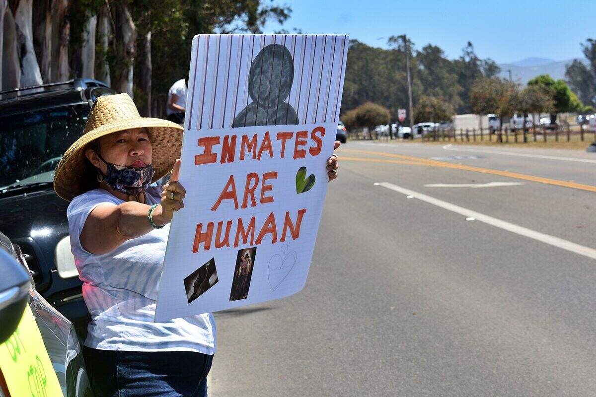 Hundreds of demonstrators gathered along Santa Lucia Canyon Road across from the Lompoc federal prison complex Sunday to protest conditions inside. The prison’s massive coronavirus outbreak appears to have eased but families and advocates are concerned that inmates are still at risk.