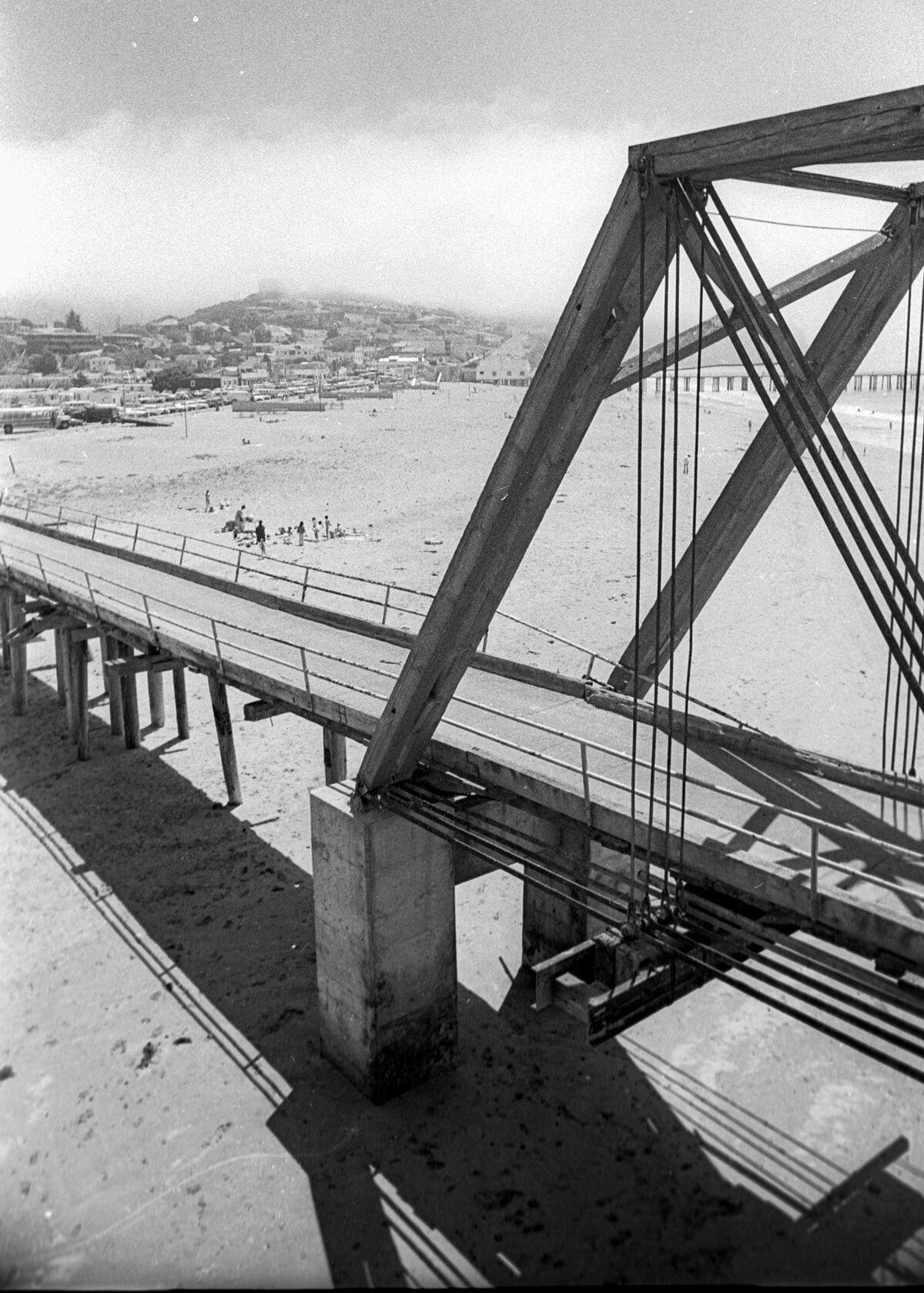 Built in 1881, the Pacific Coast Railway Bridge No. 5 was condemned and closed when it was photographed here June 26, 1976. There was a proposal to use it with a bike trail, but funding never was found. It collapsed in 1981. Storms later exposed the footings for the bridge over San Luis Creek.
