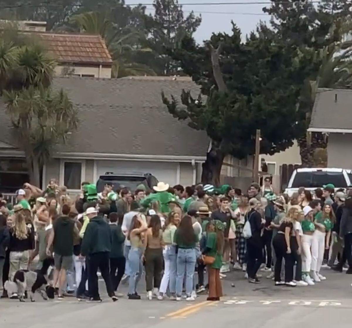 Cal Poly students gather in the street to celebrate St. Fratty’s Day in March 2020, despite COVID-19 regulations.