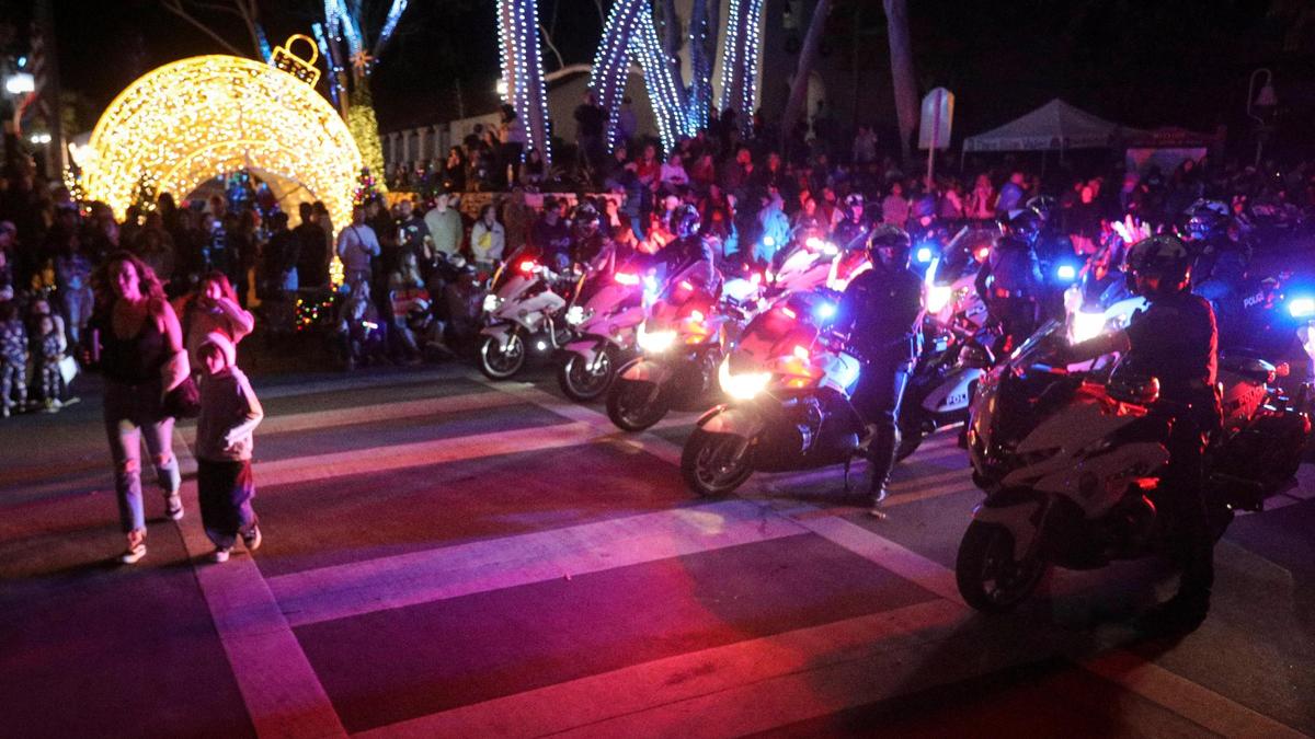San Luis Obispo Police line up to starte parade near the Mission. Unseasonably warm weather encouraged a large crowd to attend the 48th annual downtown Holiday Parade. on Dec. 6, 2024.