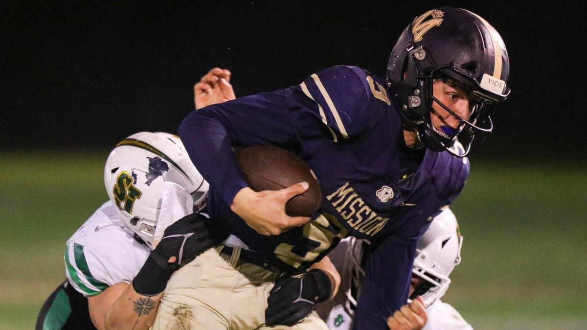Colby White was under pressure much of the night when he dropped back to pass. Mission Prep fell to St. Joseph 49-21 on Oct. 28, 2022, in the last game of the regular season, giving the Knights the Mountain League football championship.